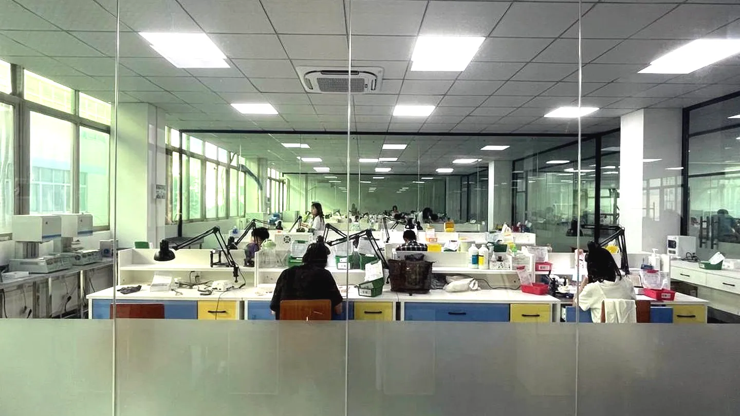 Laboratory workroom with models and appliance components on the bench.