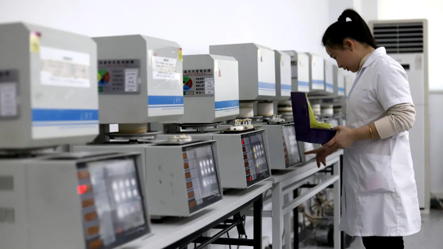A technician loading ceramic units into the sintering furnaces